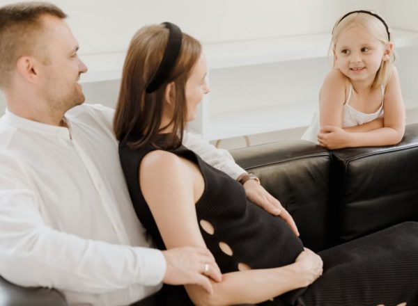 A loving family shares a tender moment, embracing joy and connection.